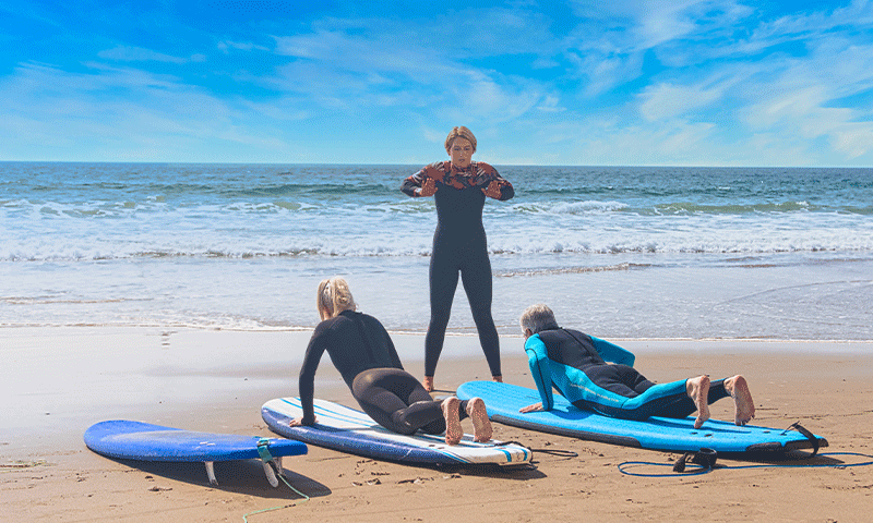 surf-therapy Two Clients and surf instructor doing surf therapy at The Pointe Malibu